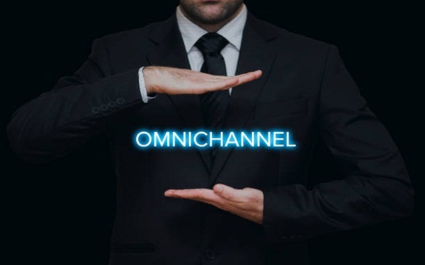 The concept of Omnichannel with businessman on black background